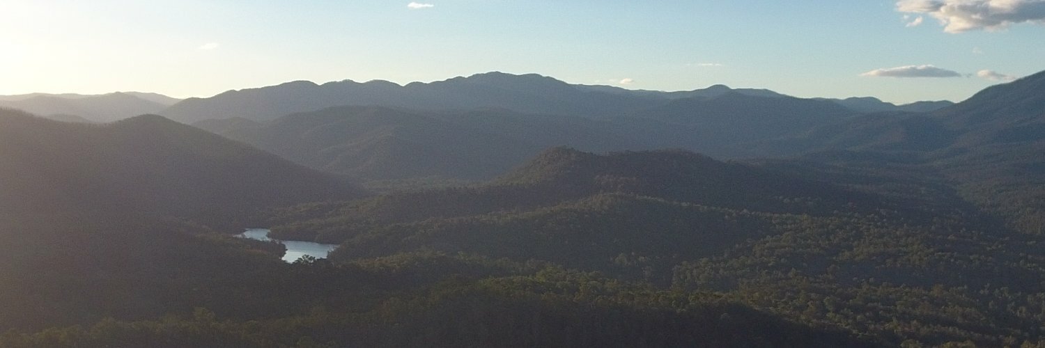 A view of the Brogo River valley looking over Brogo Dam. Shot from a drone at sunset.